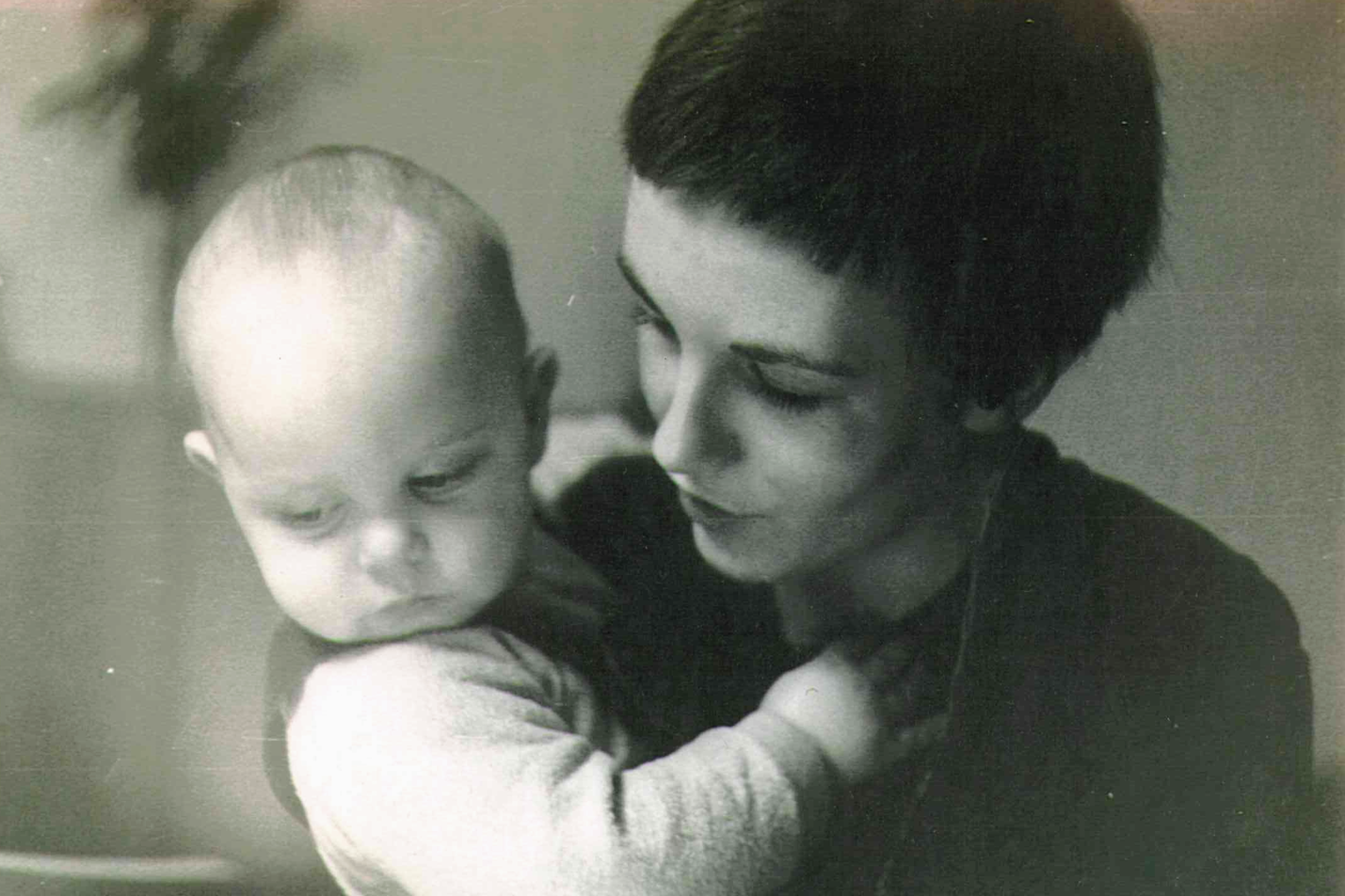 Henning as a baby being held by his mother